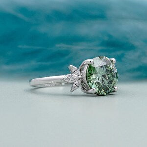Round cut Antique Green Diamond Ring with Marquise Side Stone | IGI Certified