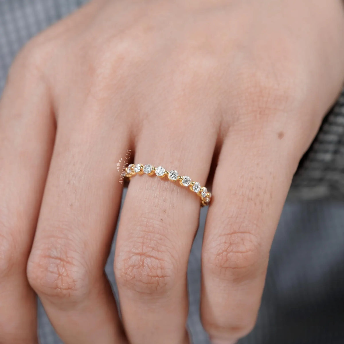 Yellow gold wedding ring with continuous round diamond setting