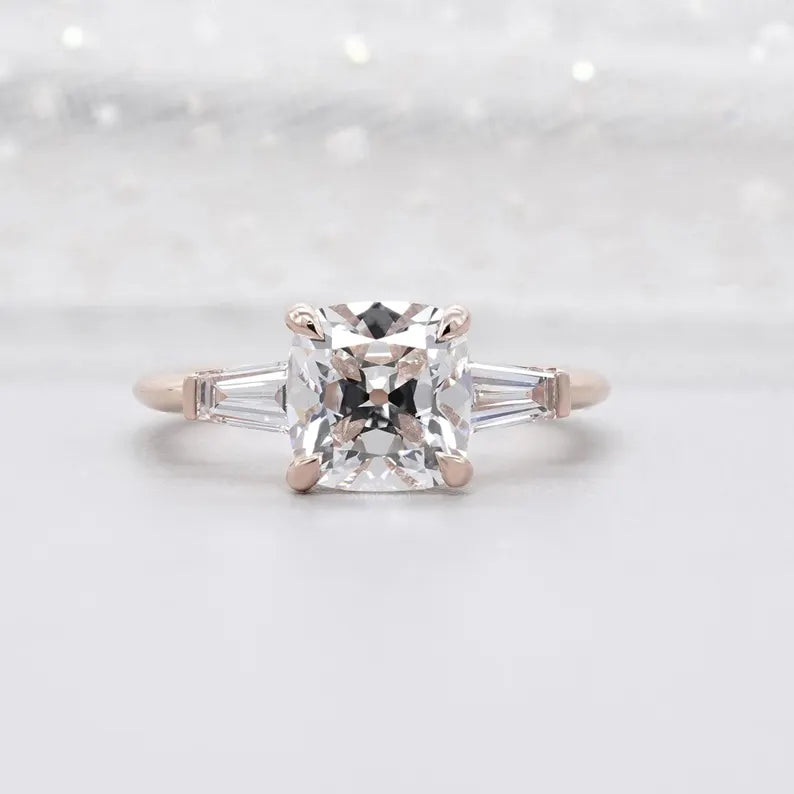 Three stone old mine cushion diamond ring rose gold