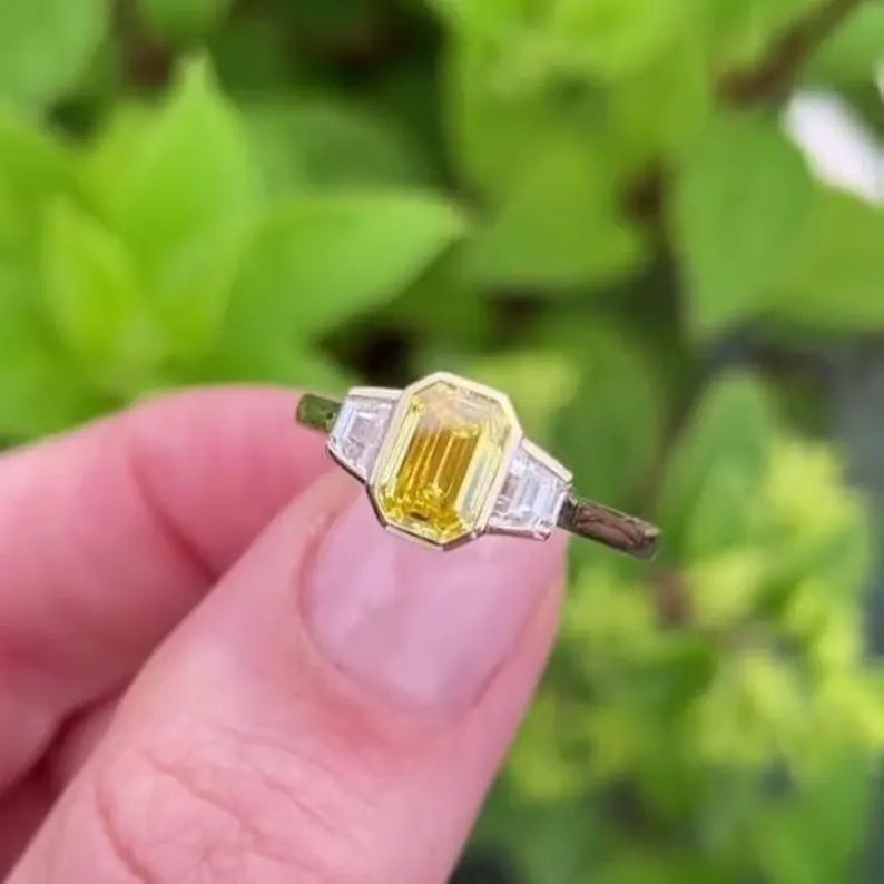 Fancy Yellow Emerald 1.50tcw Lab Grown Diamond Three Stone Ring | IGI Certified VVS–VS