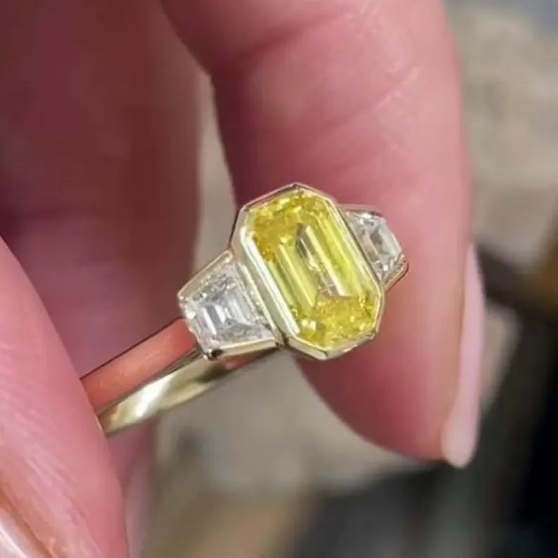 Fancy Yellow Emerald 1.50tcw Lab Grown Diamond Three Stone Ring | IGI Certified VVS–VS