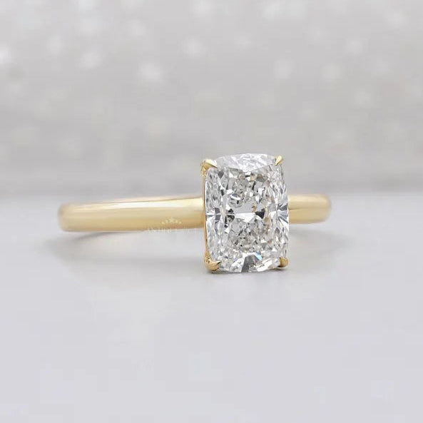 Cushion cut solitaire diamond ring in white gold