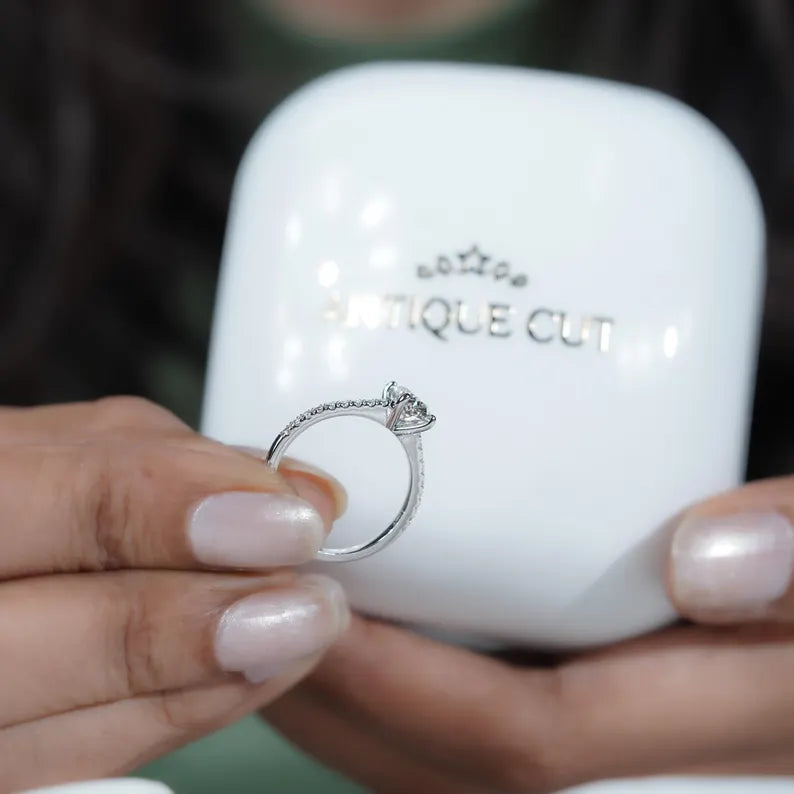 Oval lab grown diamond ring with pave accents