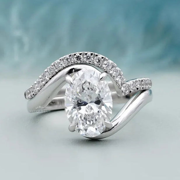 Oval bypass engagement ring in white gold