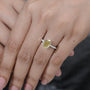 Gold ring with a diamond on a person's finger

