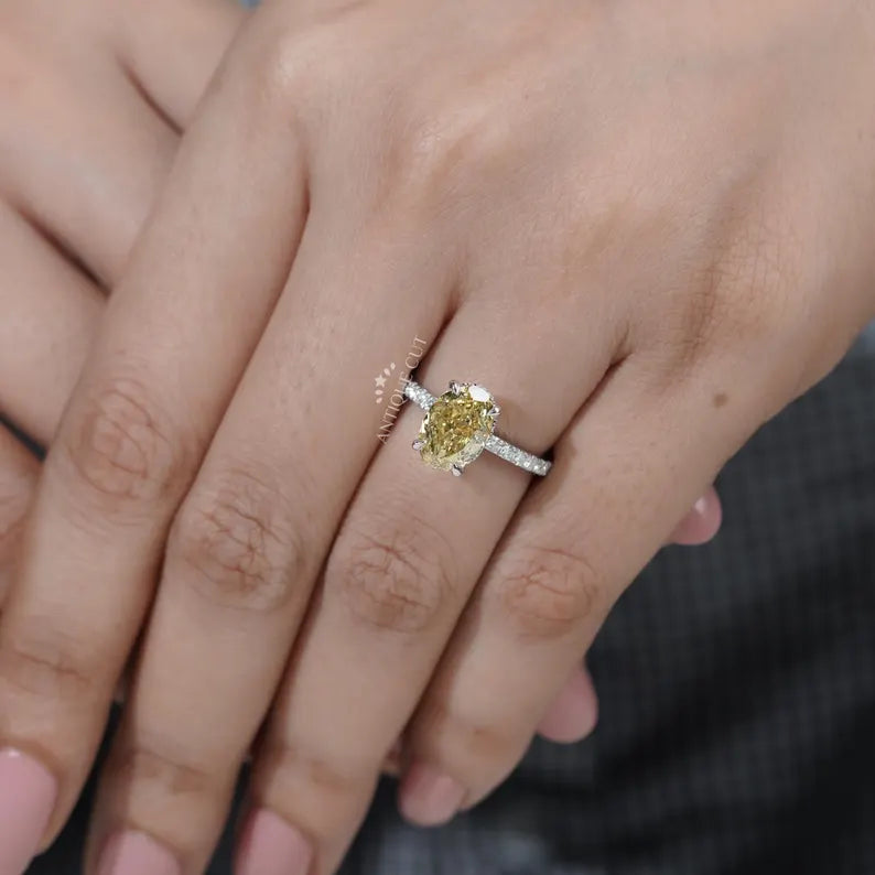 Gold ring with a diamond on a person's finger

