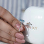 Hidden halo oval blue diamond solitaire ring elegant design