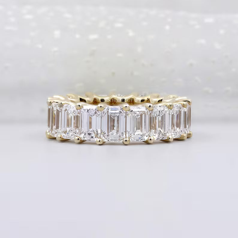Emerald cut diamond eternity band in yellow gold
