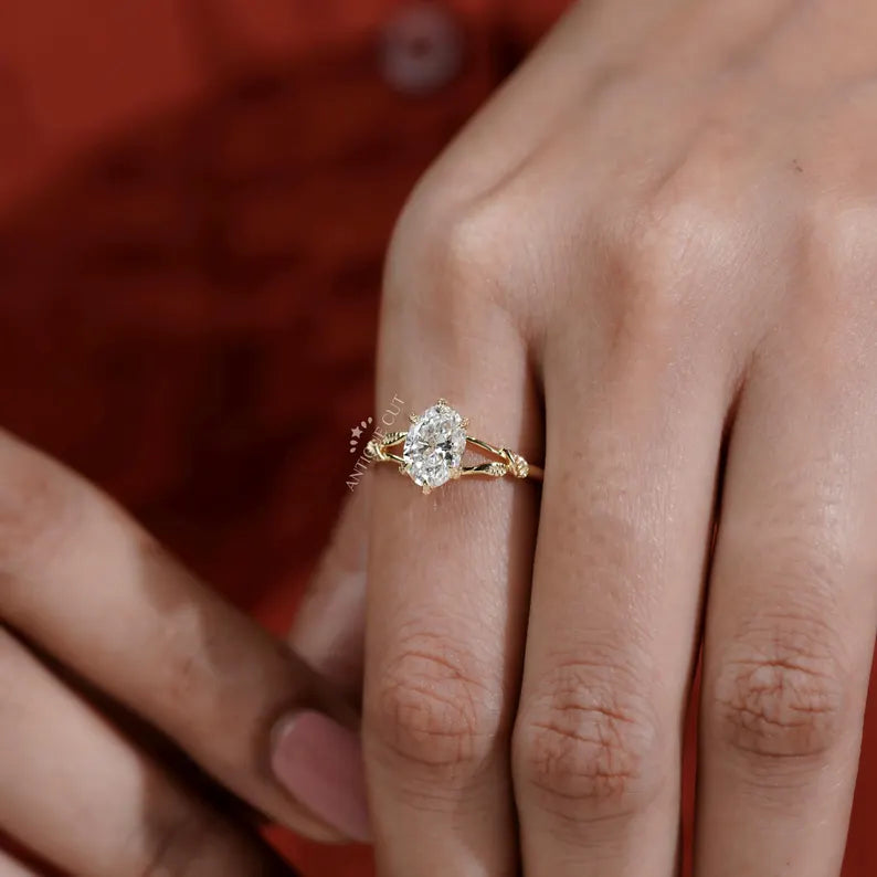 Oval diamond solitaire with intricate floral band