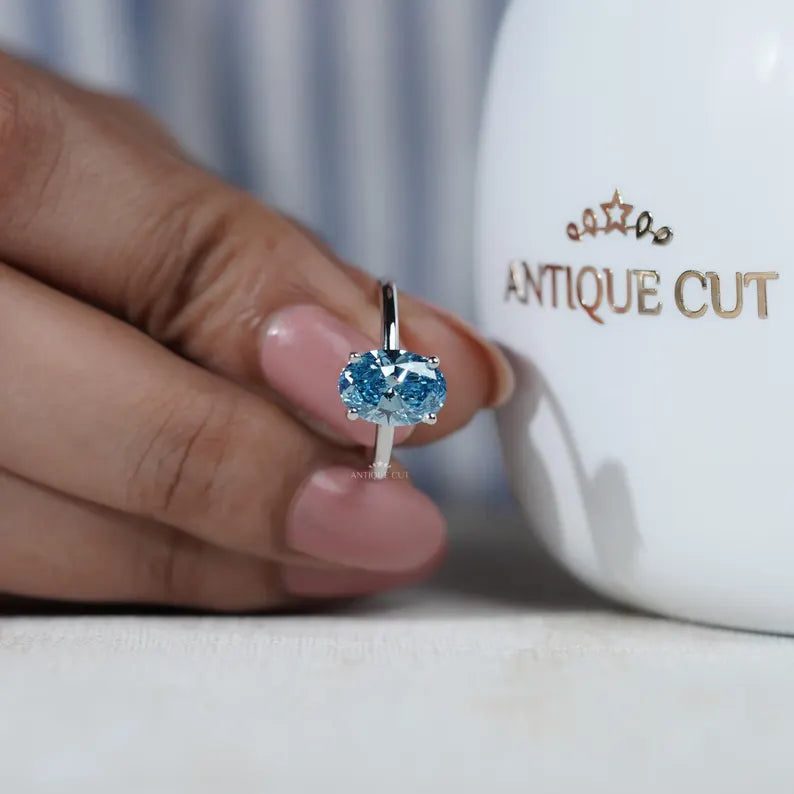 Vintage inspired blue diamond solitaire ring white gold
