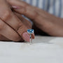 Timeless blue diamond solitaire engagement ring
