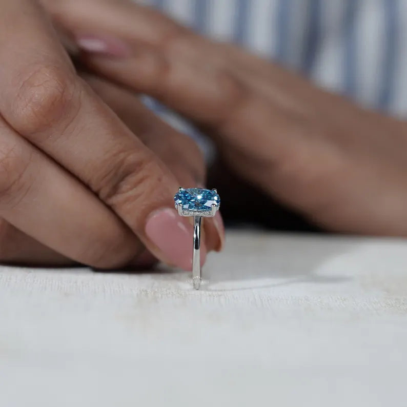 Timeless blue diamond solitaire engagement ring
