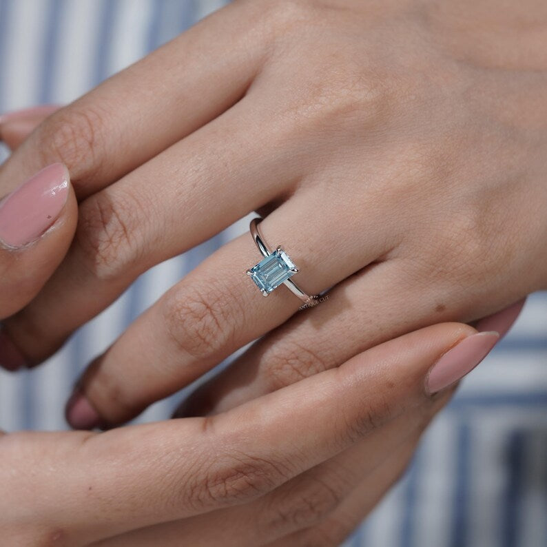 Timeless blue diamond solitaire engagement ring