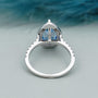 Antique cut blue pear diamond engagement ring halo
