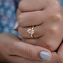 Timeless pear fancy pink diamond ring with pave band