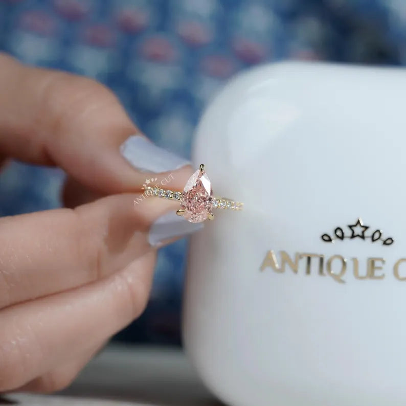 Pear cut pink diamond engagement ring yellow gold