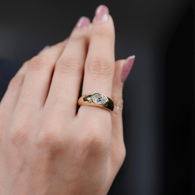 Low profile yellow gold bezel engagement ring