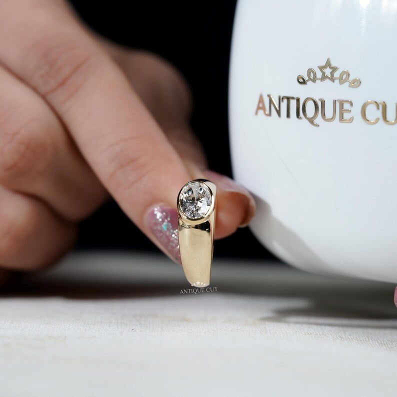 IGI certified oval diamond in bezel setting