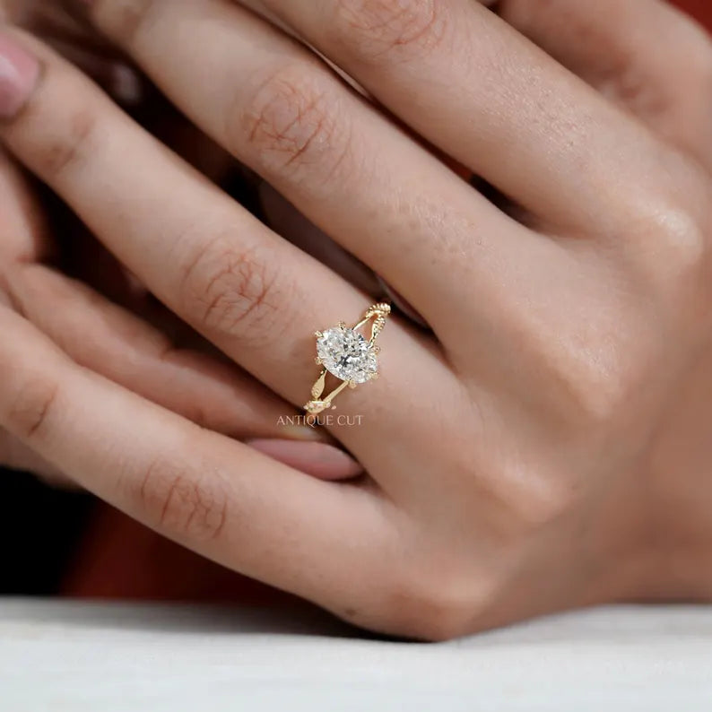 Antique inspired oval solitaire engagement ring