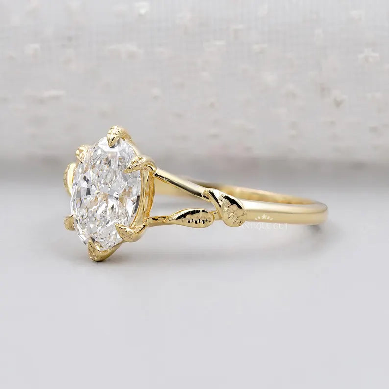 Vintage inspired floral leaf oval solitaire ring