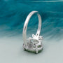 4 prong oval green diamond ring with side stones