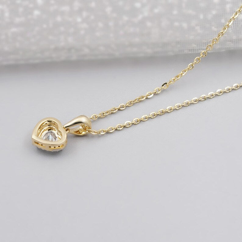 Close up of heart diamond halo pendant