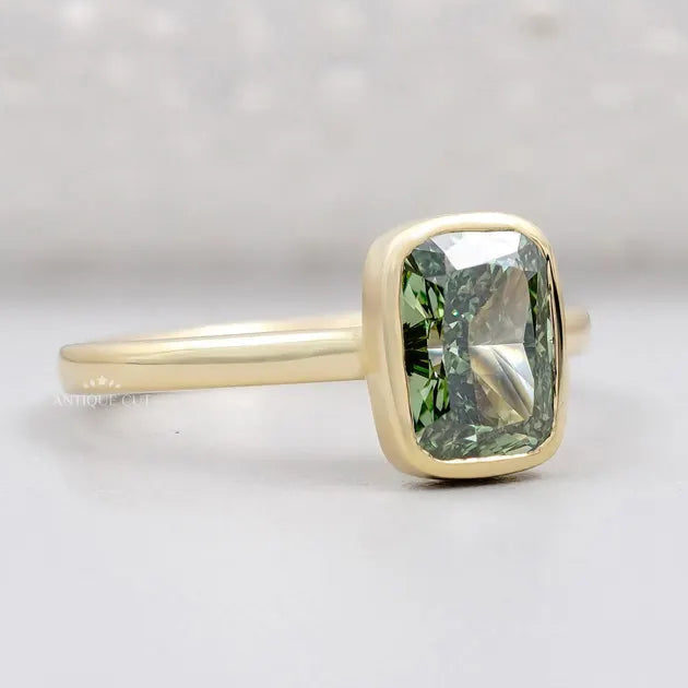 Bezel set fancy green cushion diamond engagement ring