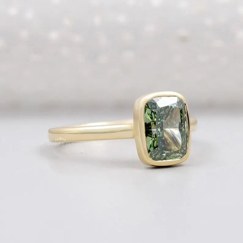 Solitaire cushion bezel engagement ring close view.