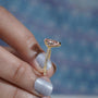 Elegant pink diamond yellow gold ring.