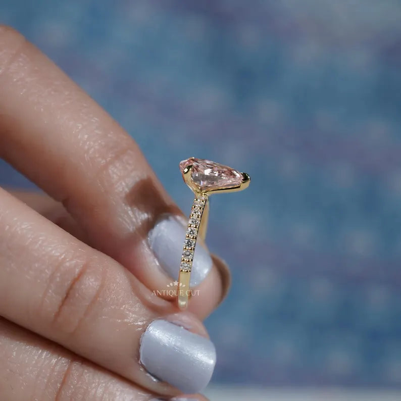 Elegant pink diamond yellow gold ring.