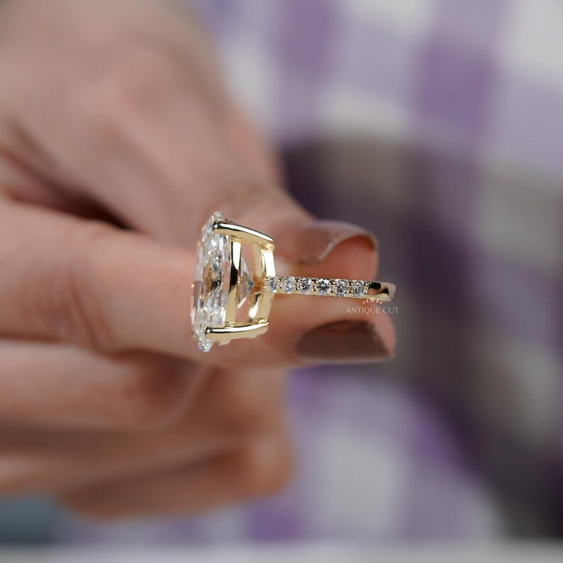 Large oval engagement ring with round diamond accents