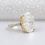 Yellow gold oval engagement ring with pavé diamond band