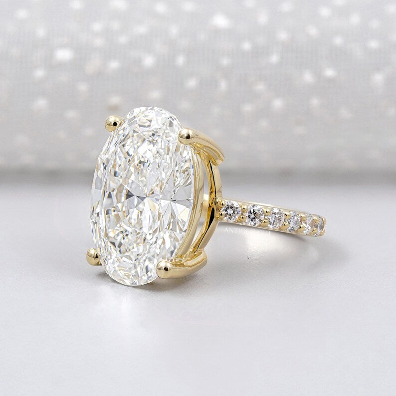 Large oval lab grown diamond ring with round side stones