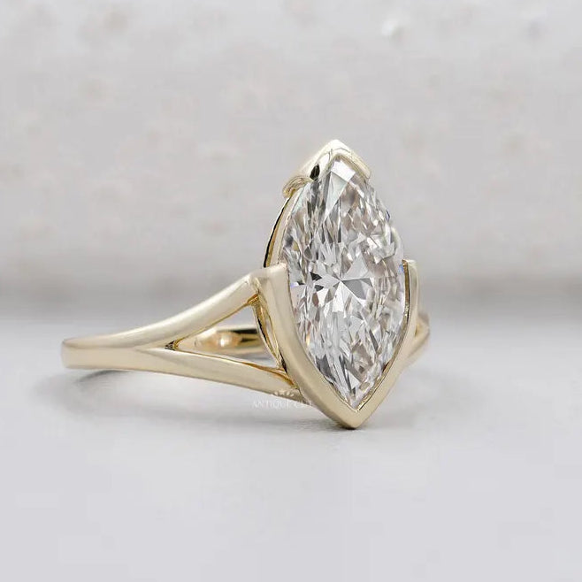 Yellow gold marquise engagement ring with split band
