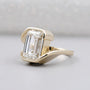 Yellow gold emerald cut solitaire ring