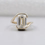 Half Bezel set emerald ring with solitaire diamond