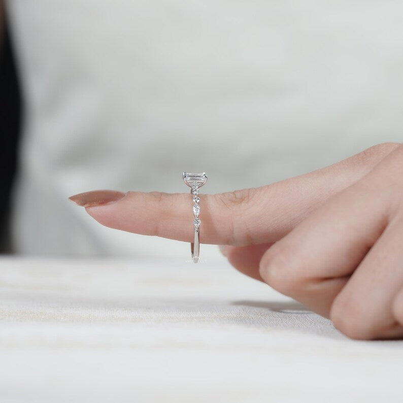 Elegant white gold emerald cut engagement ring with pave stones