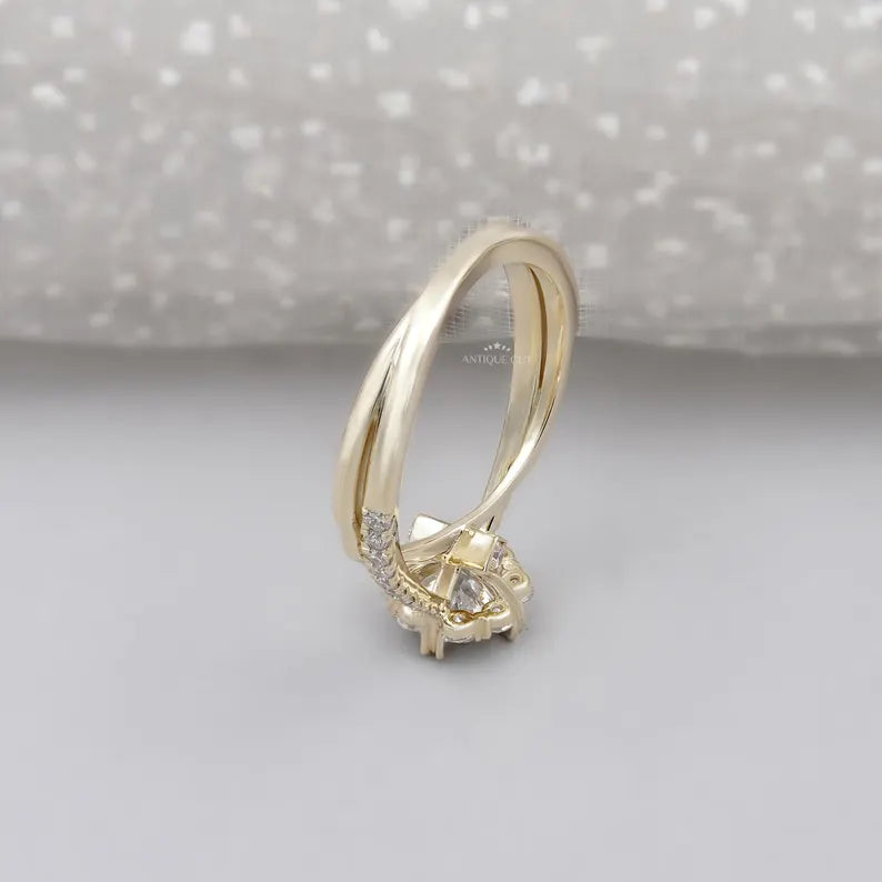 Round cut solitaire diamond with floral halo