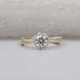 Round cut engagement ring with floral halo