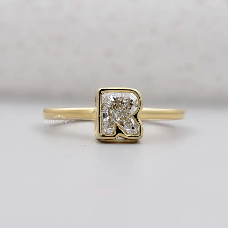 R letter ring bezel set diamond yellow gold
