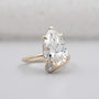 Yellow gold pear cut diamond engagement ring with side stones