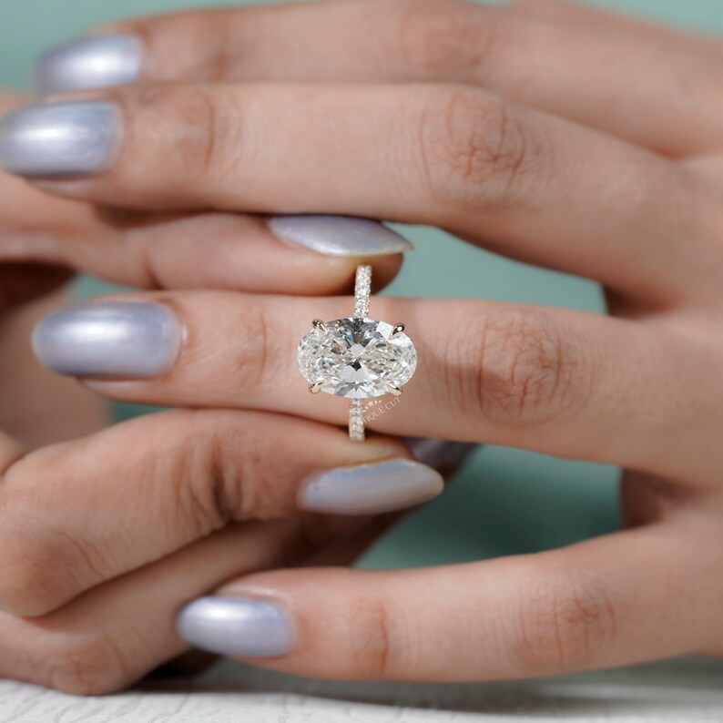 Timeless oval diamond ring hidden halo yellow gold