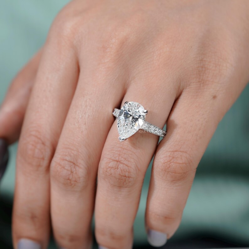 White gold engagement ring pear lab diamond pave band