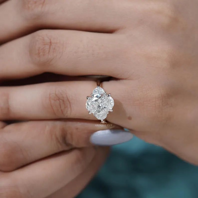 Timeless three stone oval diamond ring yellow gold band