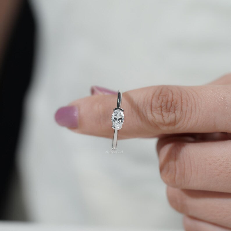 Minimal oval diamond ring horizontal setting