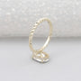 Twisted gold band engagement ring oval diamond