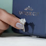 Radiant engagement ring with trilliant side stones