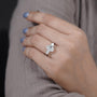 Classic three stone engagement ring with oval center diamond