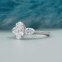 Oval diamond three stone ring with side diamonds white gold