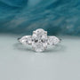 Three stone oval cut diamond engagement ring in white gold